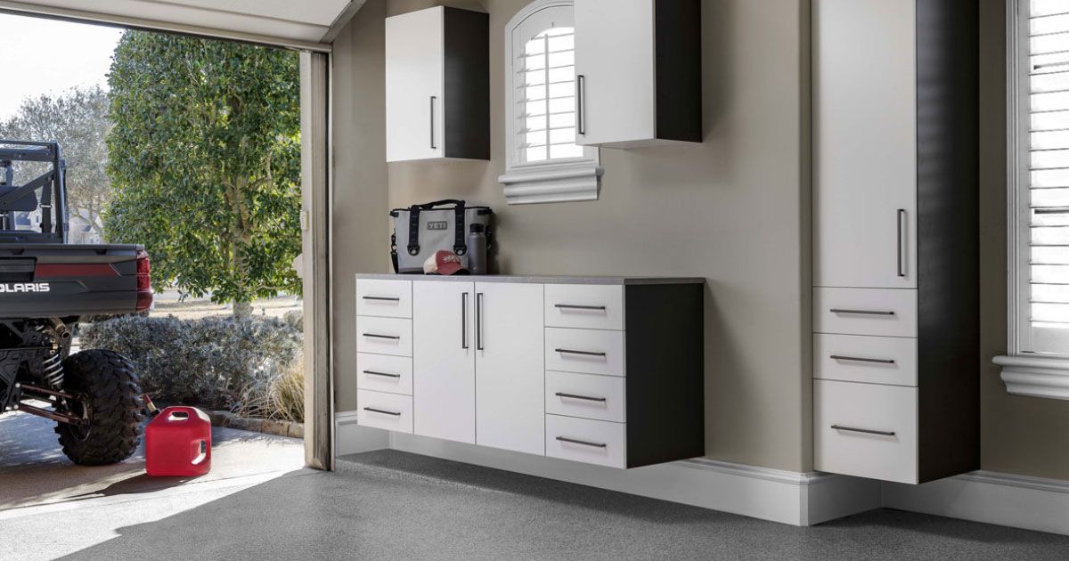 a garage with lots of cabinets and a door