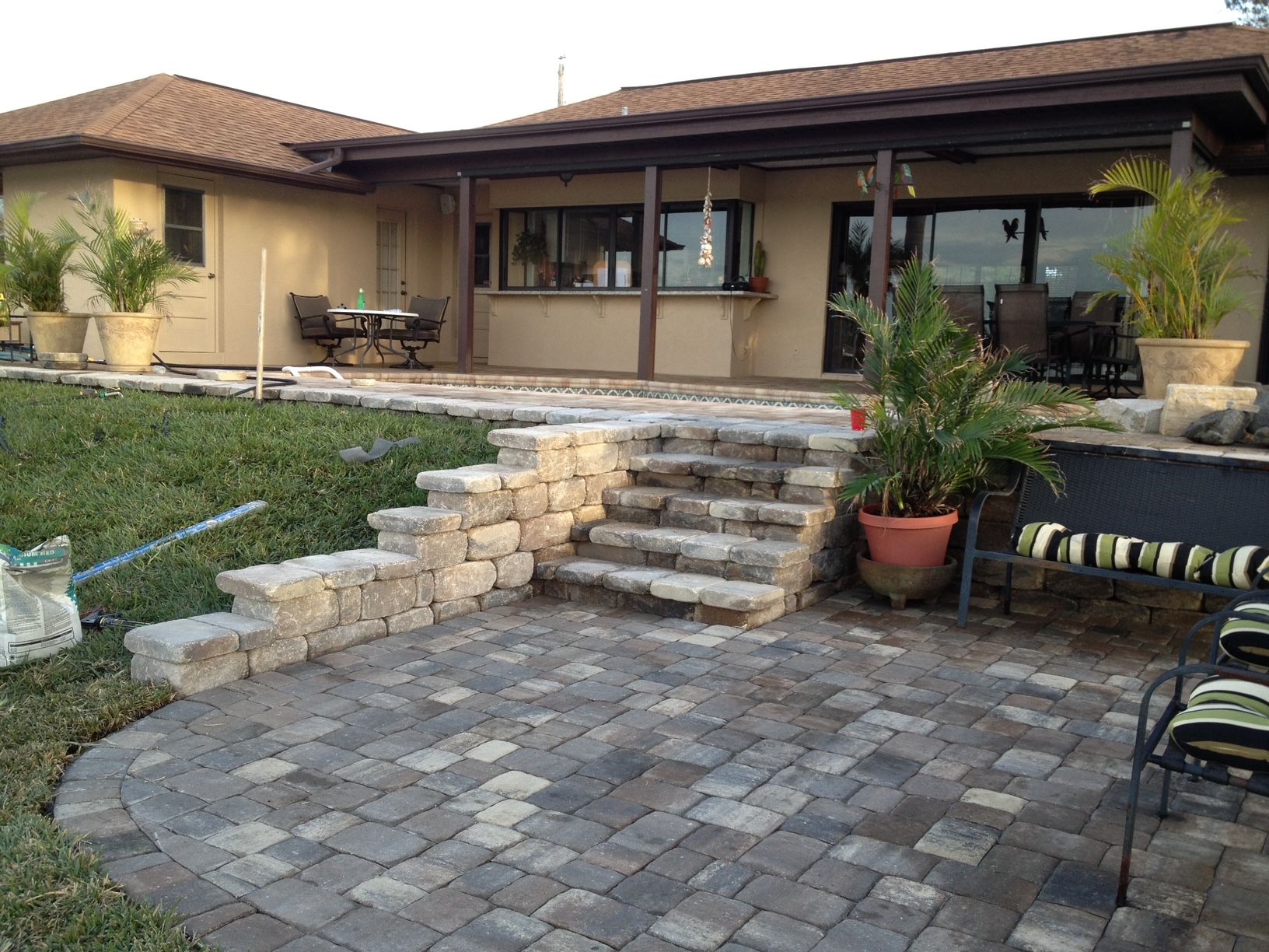 A house with a patio and stairs in front of it