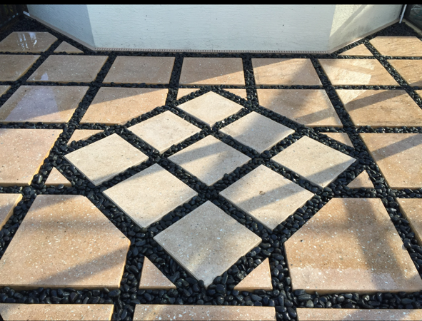 A tiled floor with a square in the middle