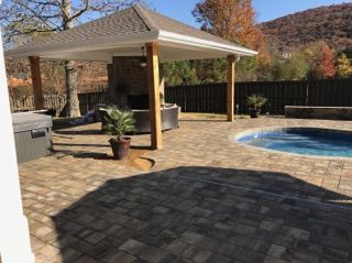 There is a gazebo and a pool in the backyard.