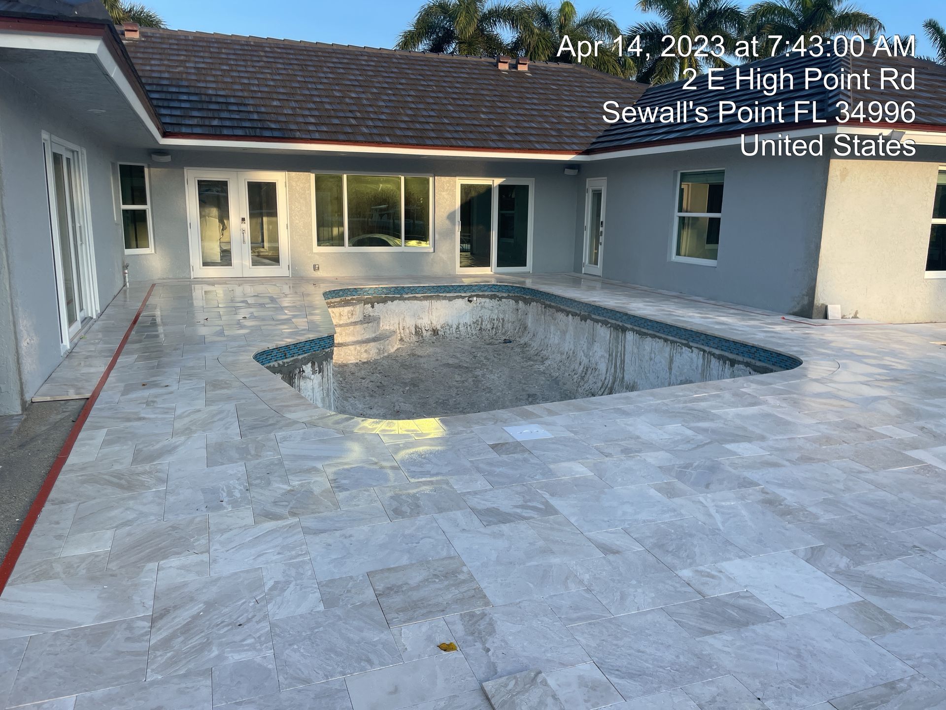 A house with a large swimming pool in the backyard