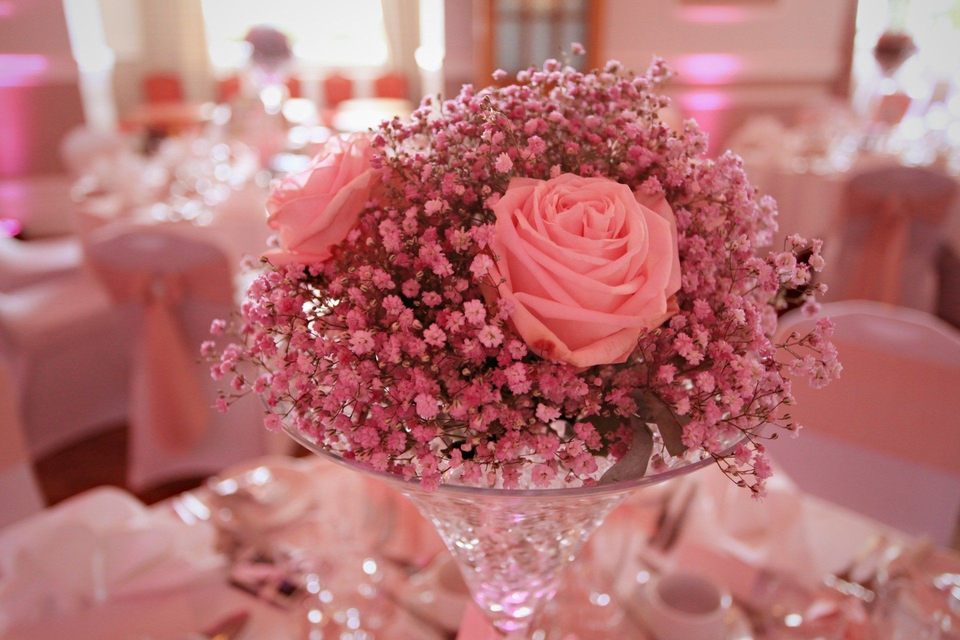 A pink bouquet in a large wedding venue