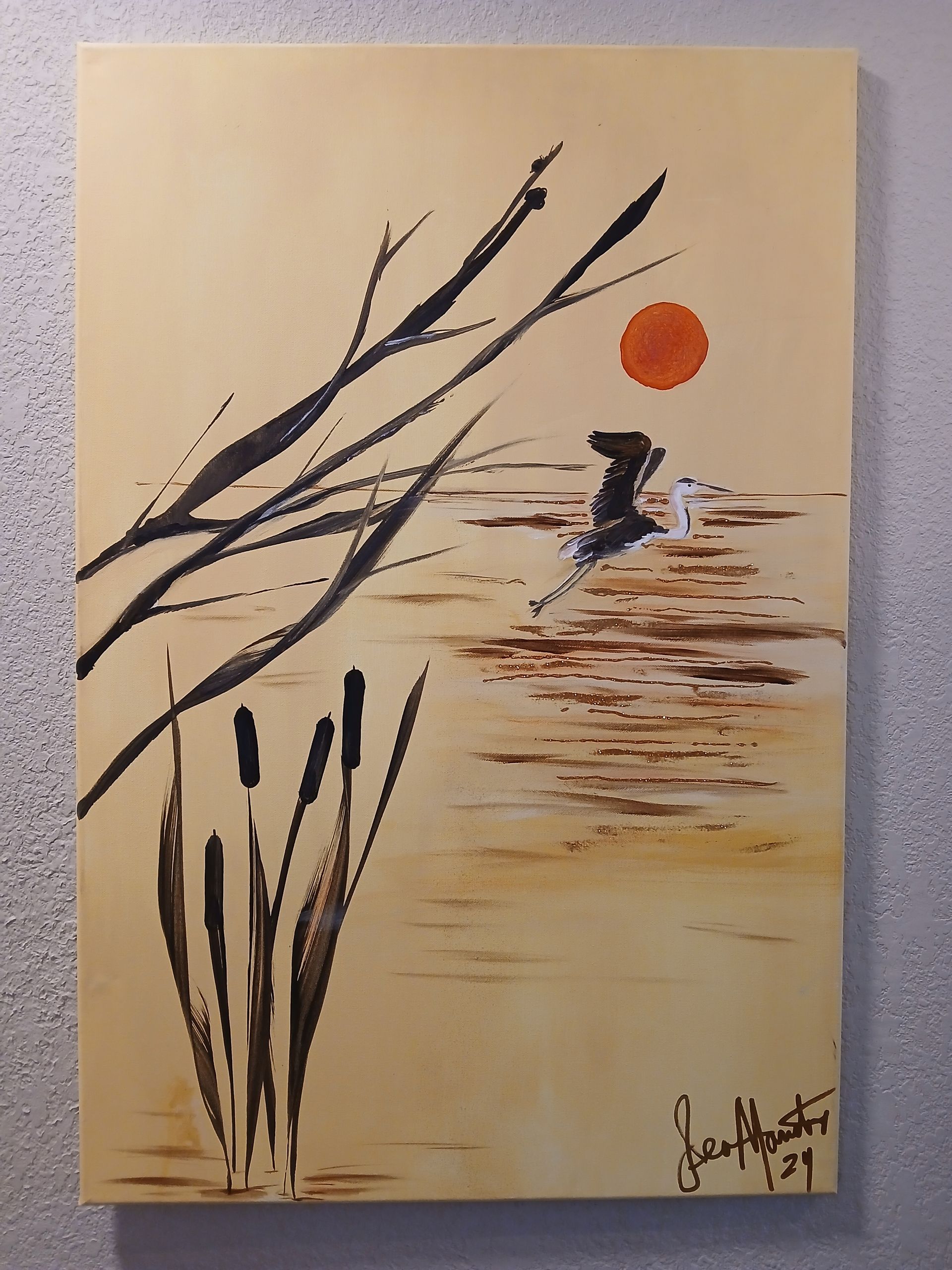 A black tray with dried paint splotches of various colors, including gold, pink, purple, and white.