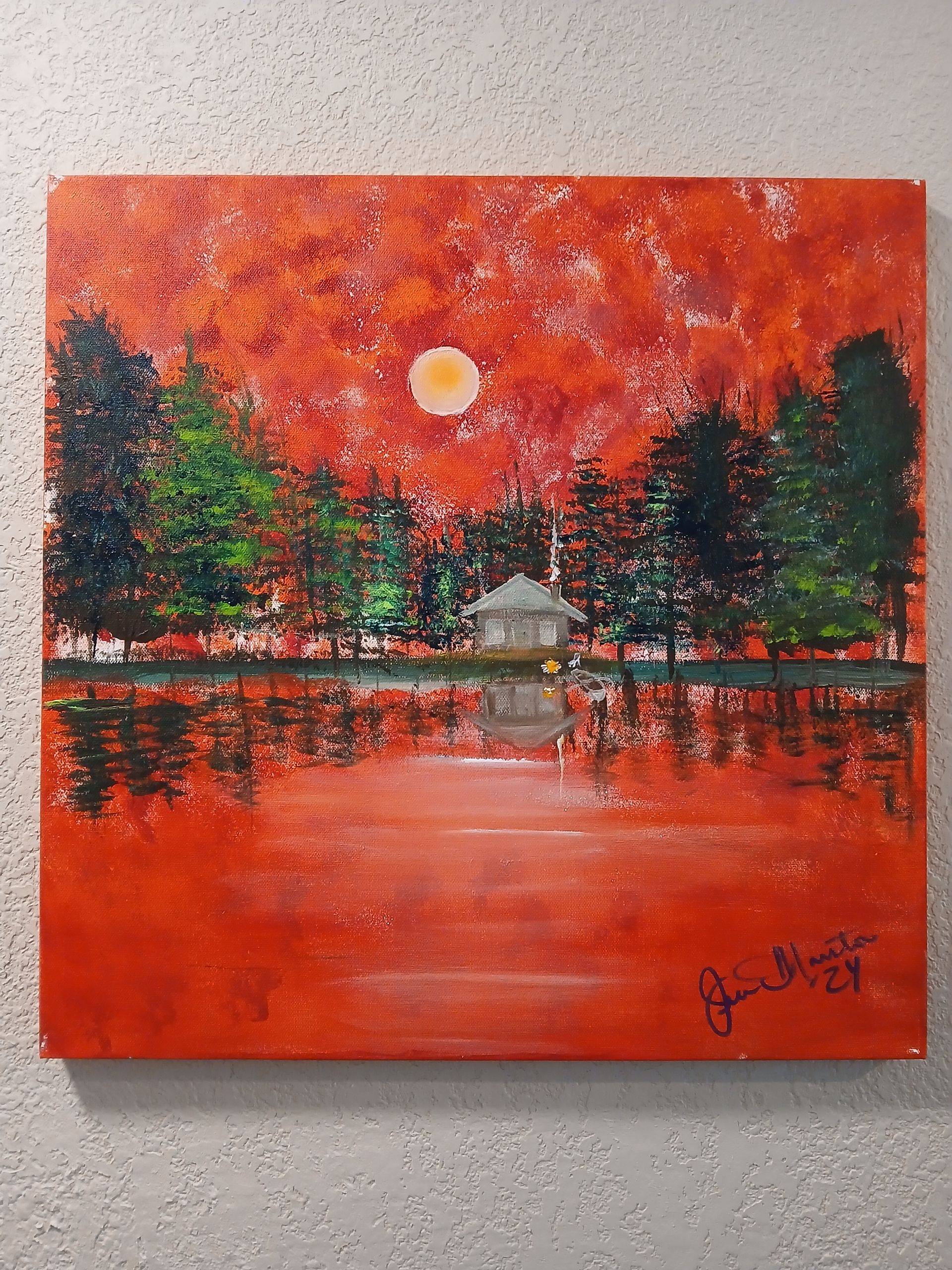 Gray plastic paint palette with mixed colors, including yellow, orange, red, white, purple, and black.