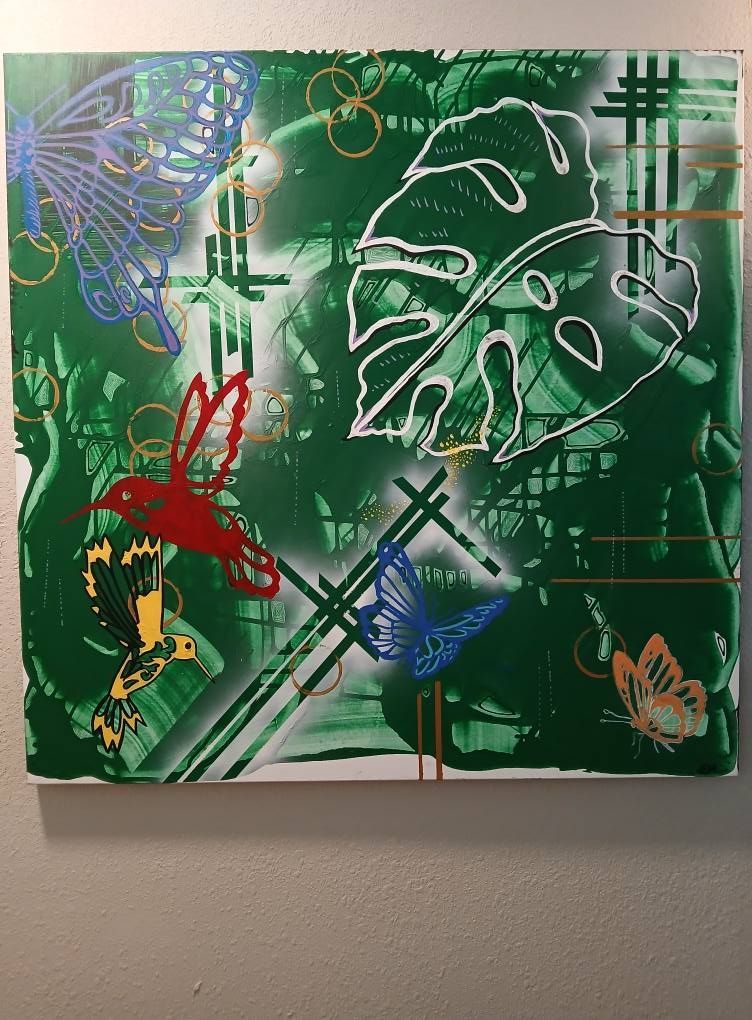 Green abstract painting with butterflies, leaf, and bird silhouettes.