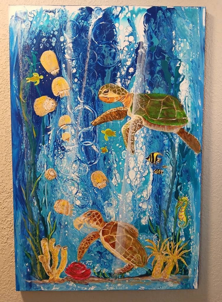 Two sea turtles swim amongst corals and fish in blue ocean depths.