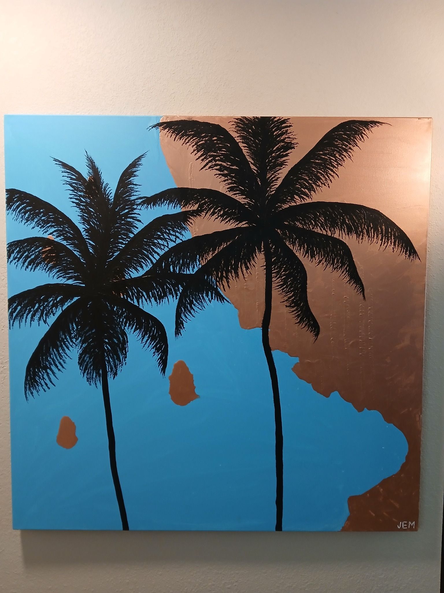 Two black palm tree silhouettes against blue and copper backgrounds.