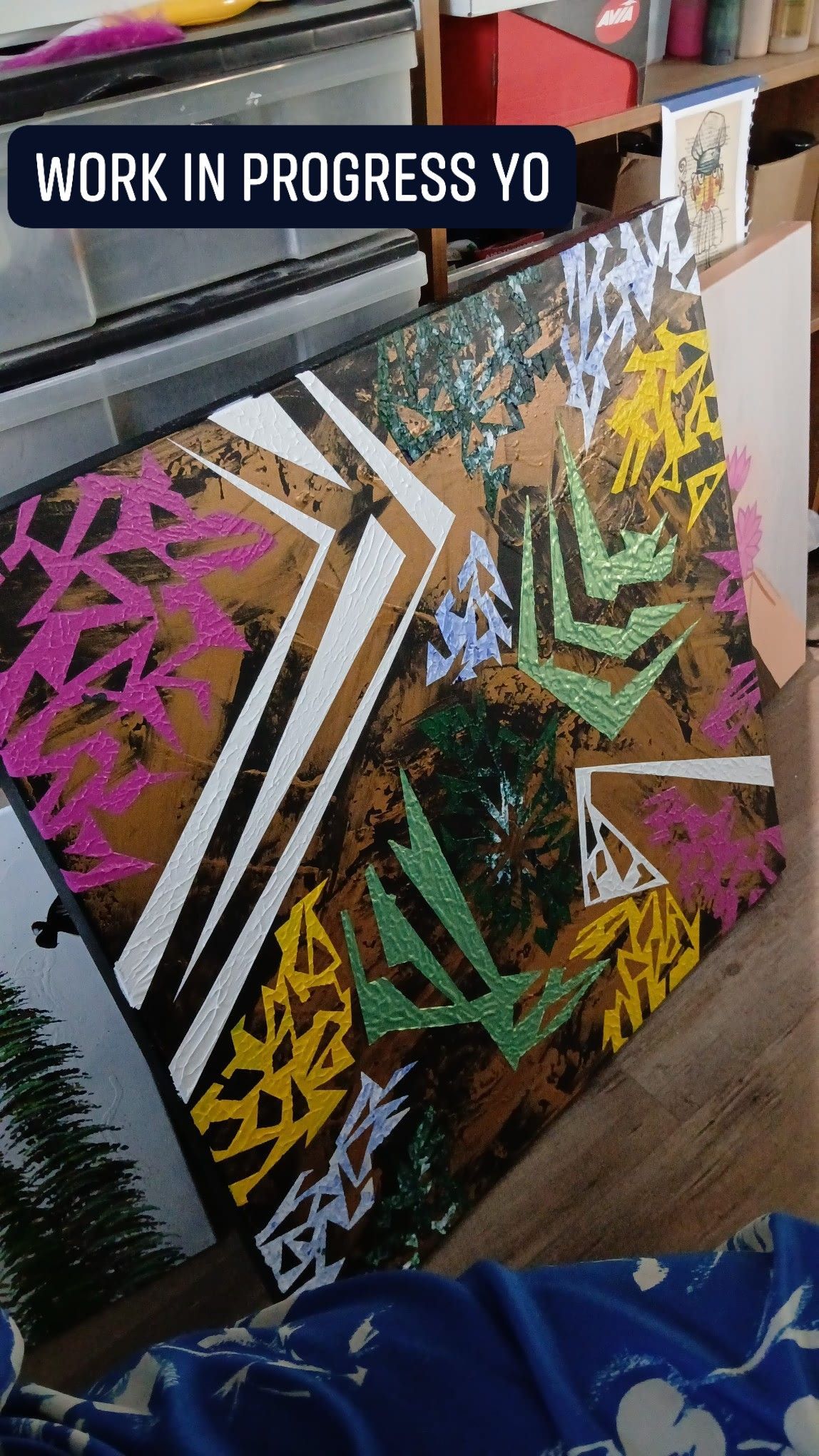 Work in progress: Abstract art piece with brown, white, pink, green, and yellow shapes on canvas.