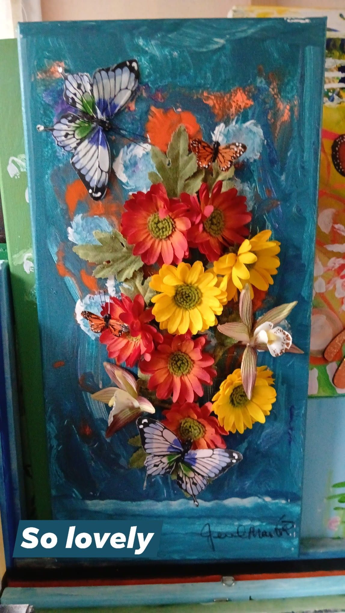 A floral painting with butterflies, featuring red, yellow, and orange flowers against a turquoise background.