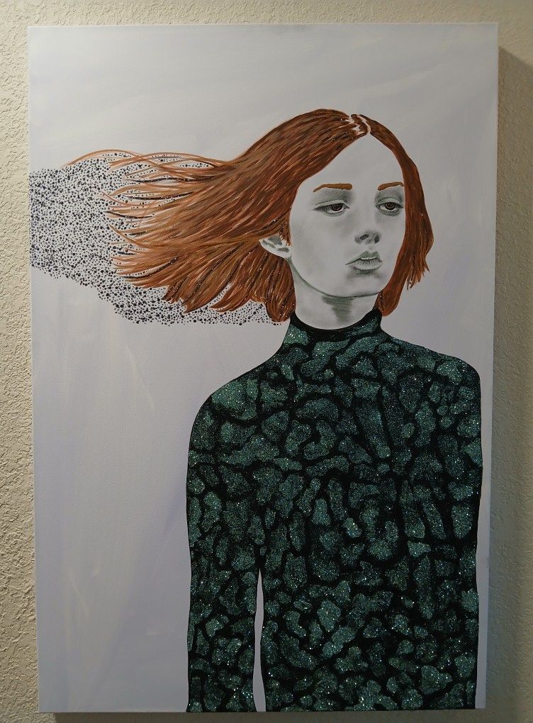 Woman with red hair, wearing a green patterned top, head turned, hair blowing left, part of which is turning into dots.