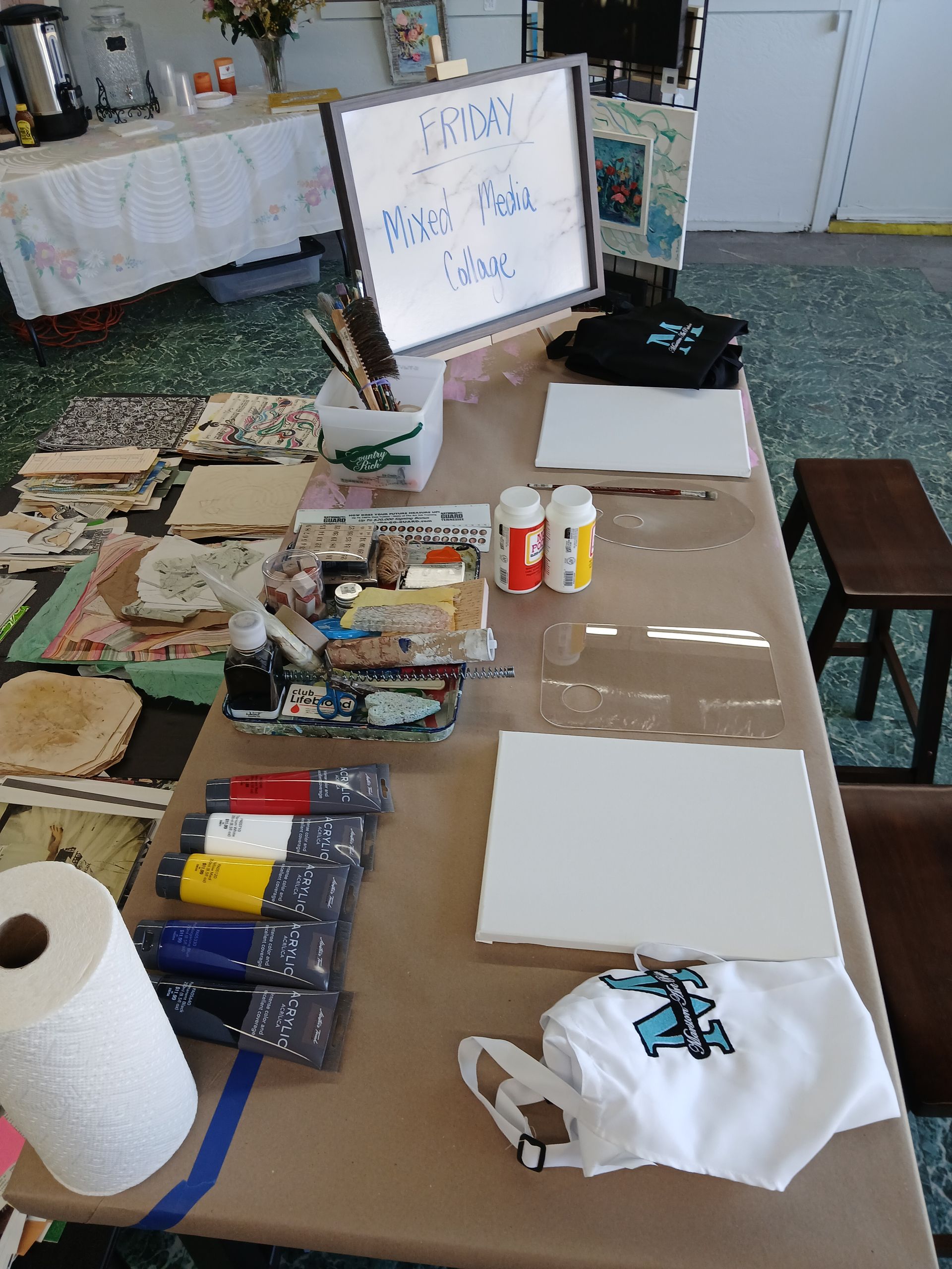 Canvas art with butterflies and flowers. Purple, red, and white against a blue and gray background.