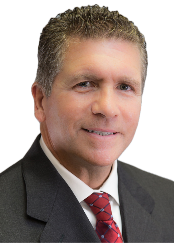 A man and a woman are sitting on a dock overlooking a lake.