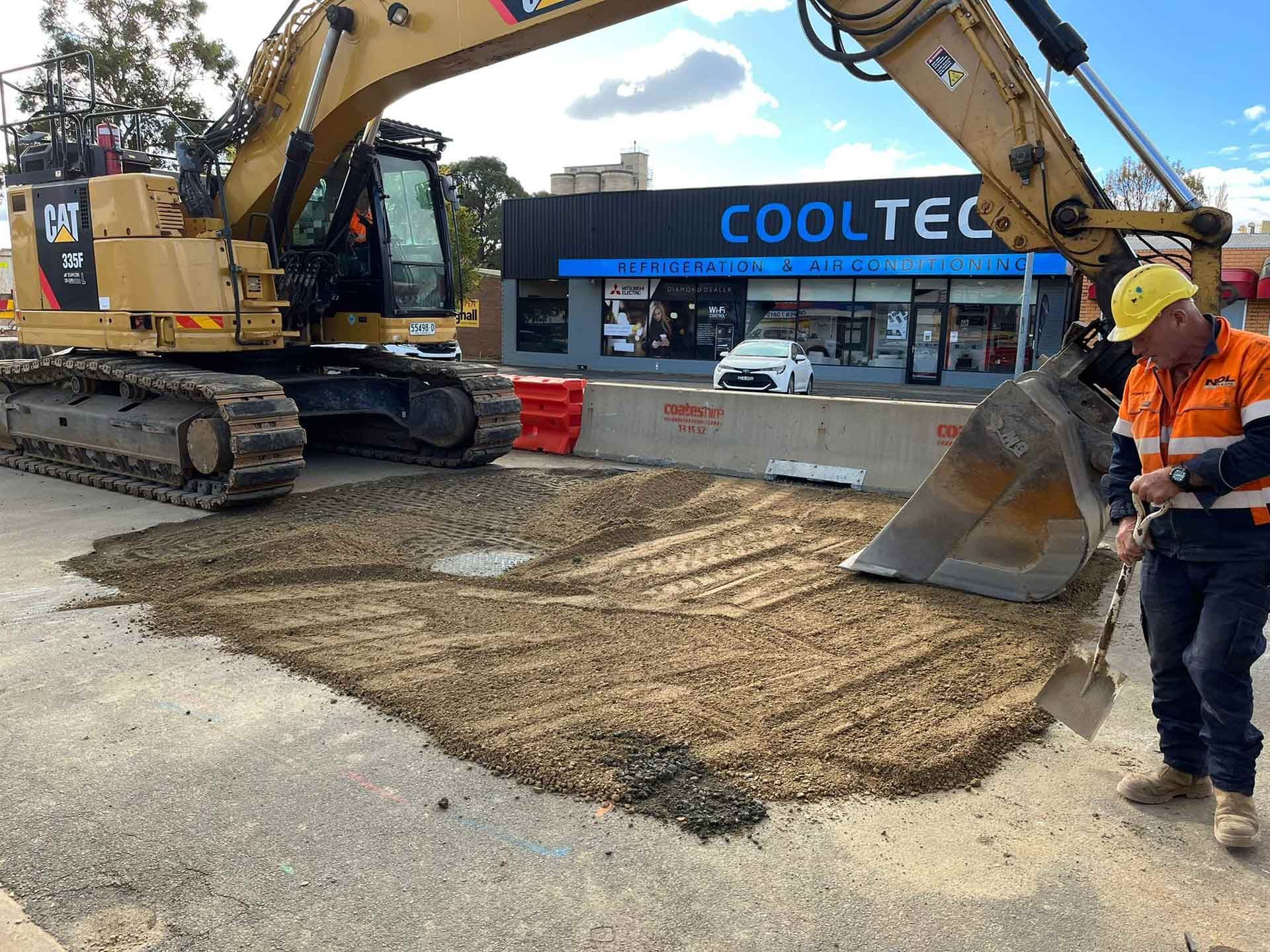 A Man with Shovel and Excavator | Young, Nsw | Ndl Pipe & Civil