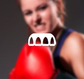 A woman wearing red boxing gloves with an icon of a bridge in the background