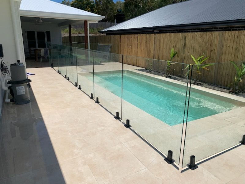 Swimming Pool Enclosed by Glass Fencing — The Fence Place in Kawana, QLD