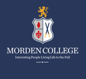 Logo of Morden College: Shield with lion, fleur-de-lis, and crossed swords on navy blue background.