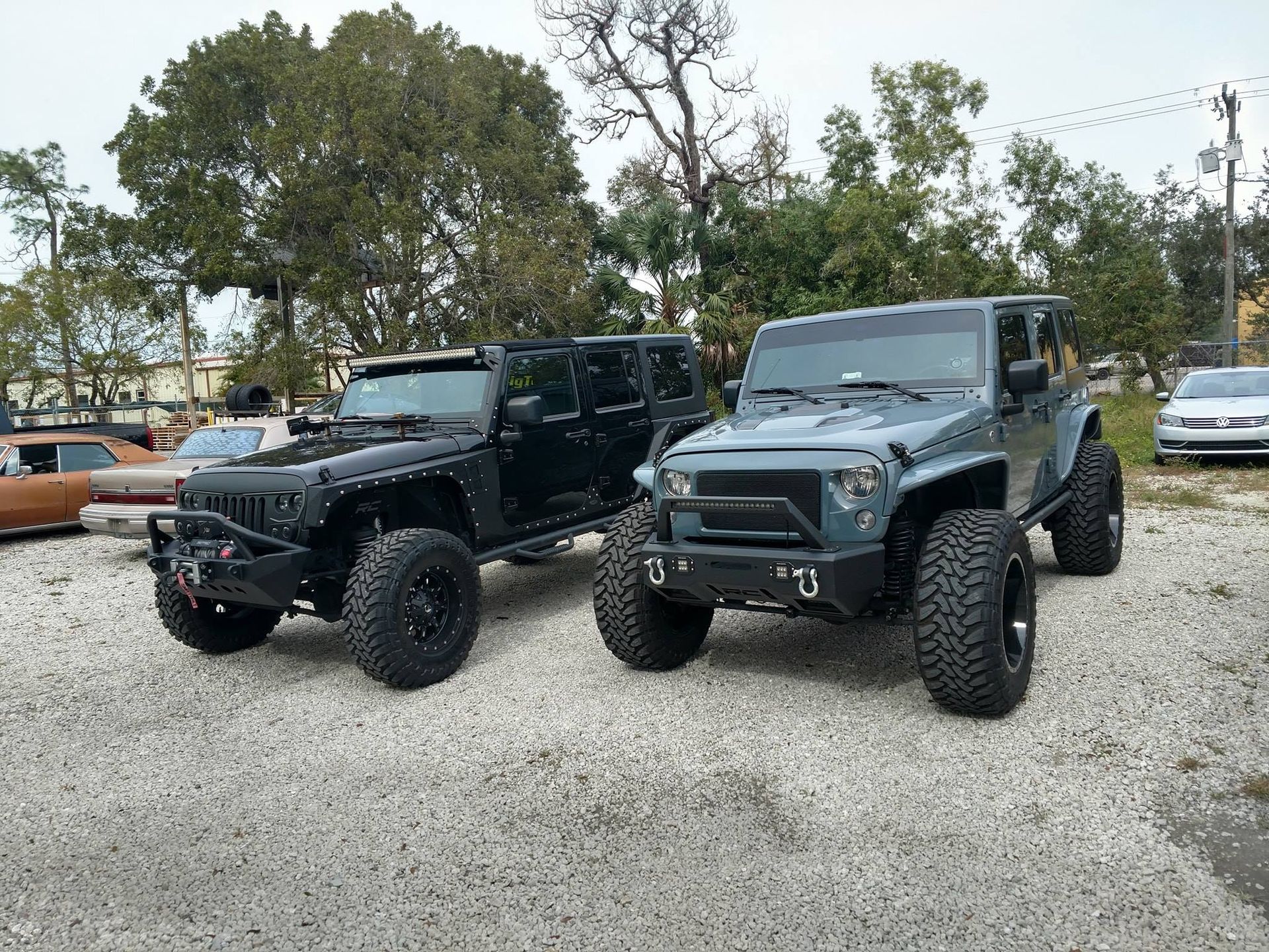 Jacked up Jeeps parked | Cypress Lake Auto Repair