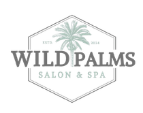 A logo for wild palms salon and spa with a palm tree on it.