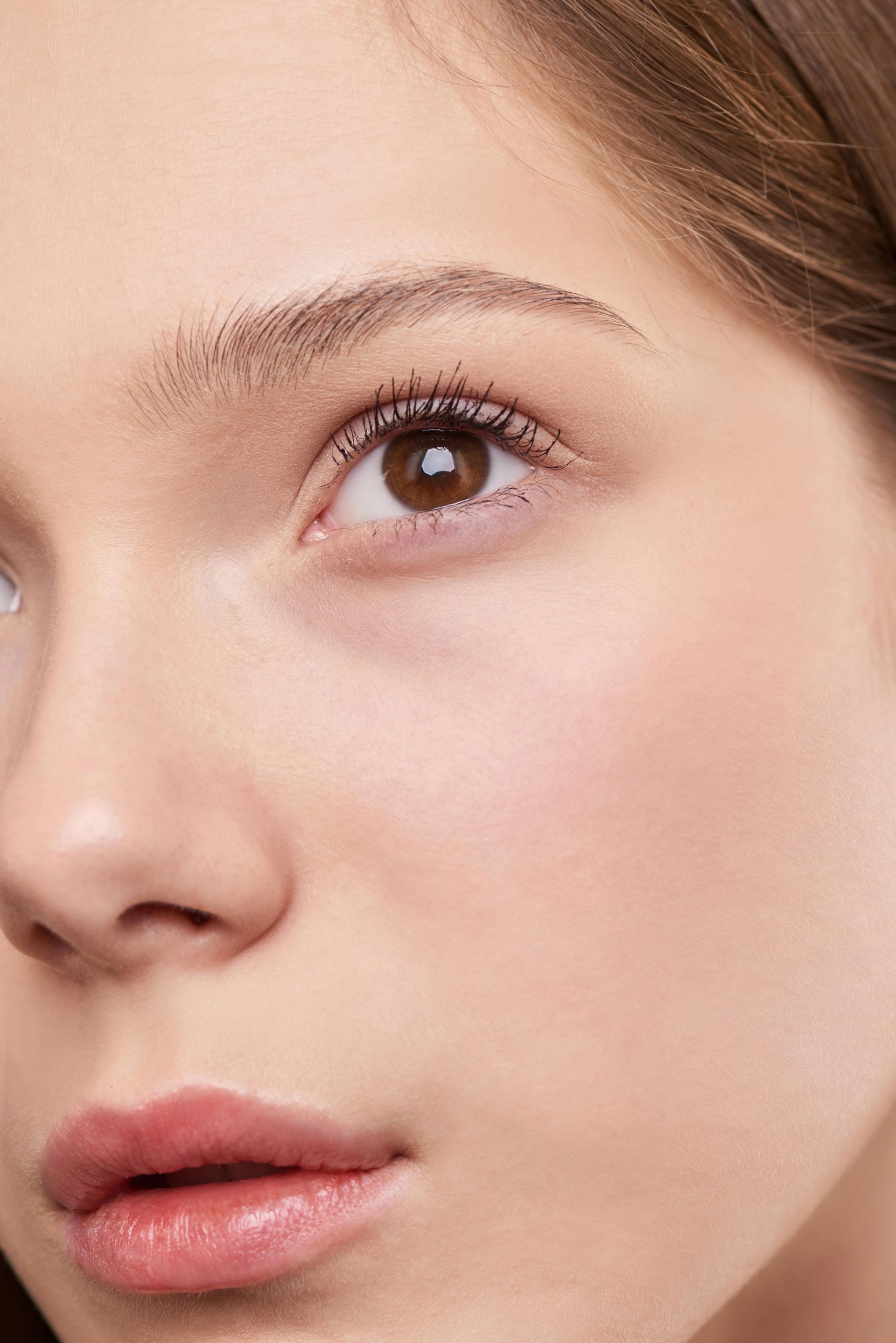 A close up of a woman 's face with makeup on.