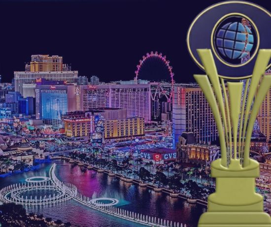 Las Vegas skyline with fountain display, award trophy in foreground.