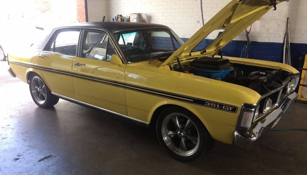 A Yellow Car With the Hood Up is Parked in a Garage — TeeJay Mechanical Repairs In Beard, ACT