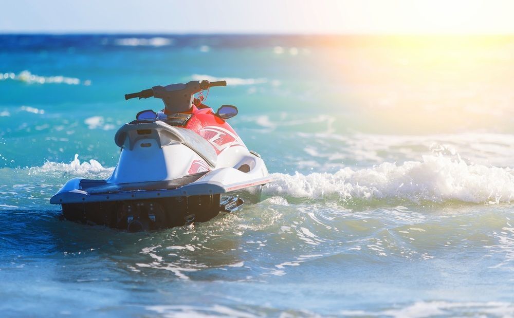 A Jet Ski is Floating on Top of a Body of Water — TeeJay Mechanical Repairs In Beard, ACT