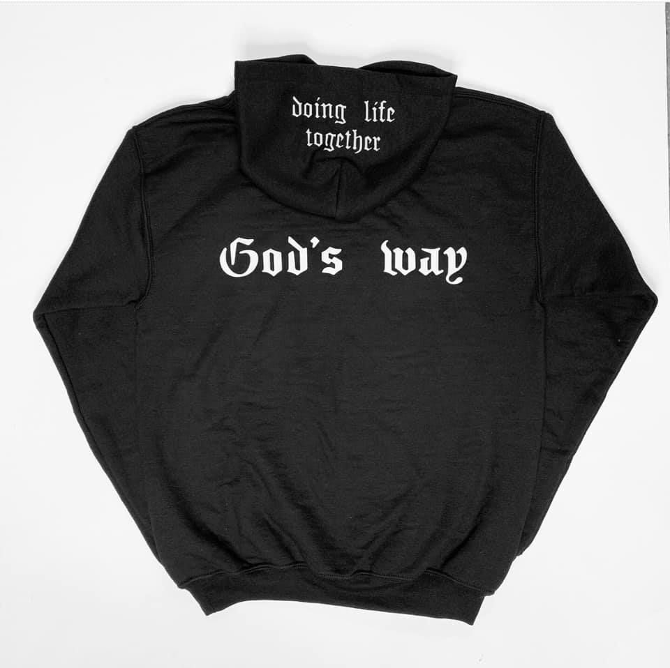 A black hoodie that says god 's way on the back