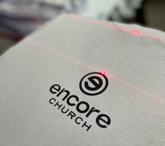 A close up of the logo for encore church