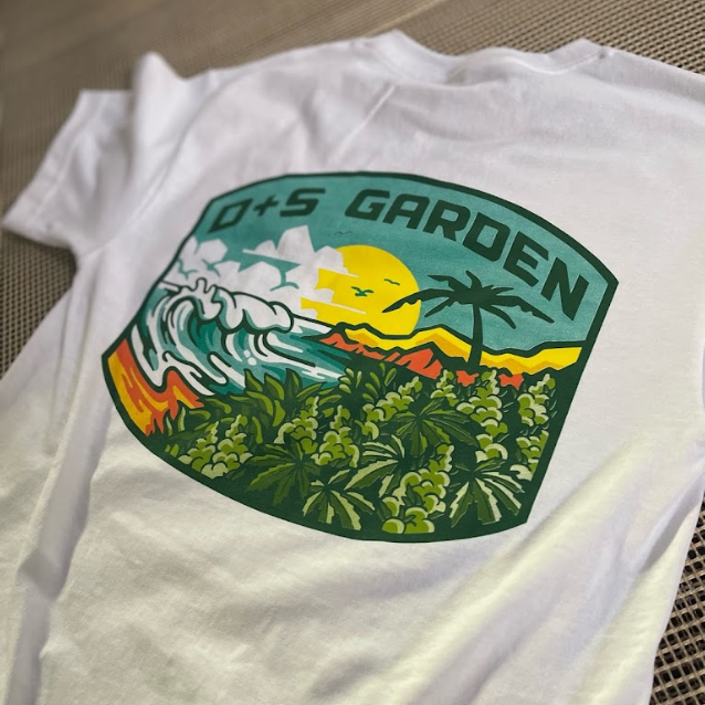 A white shirt that says d + s garden on the back