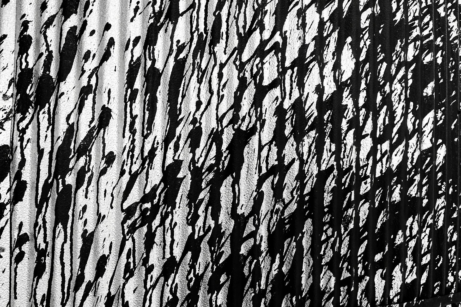 A close up of a road with two yellow lines on it.