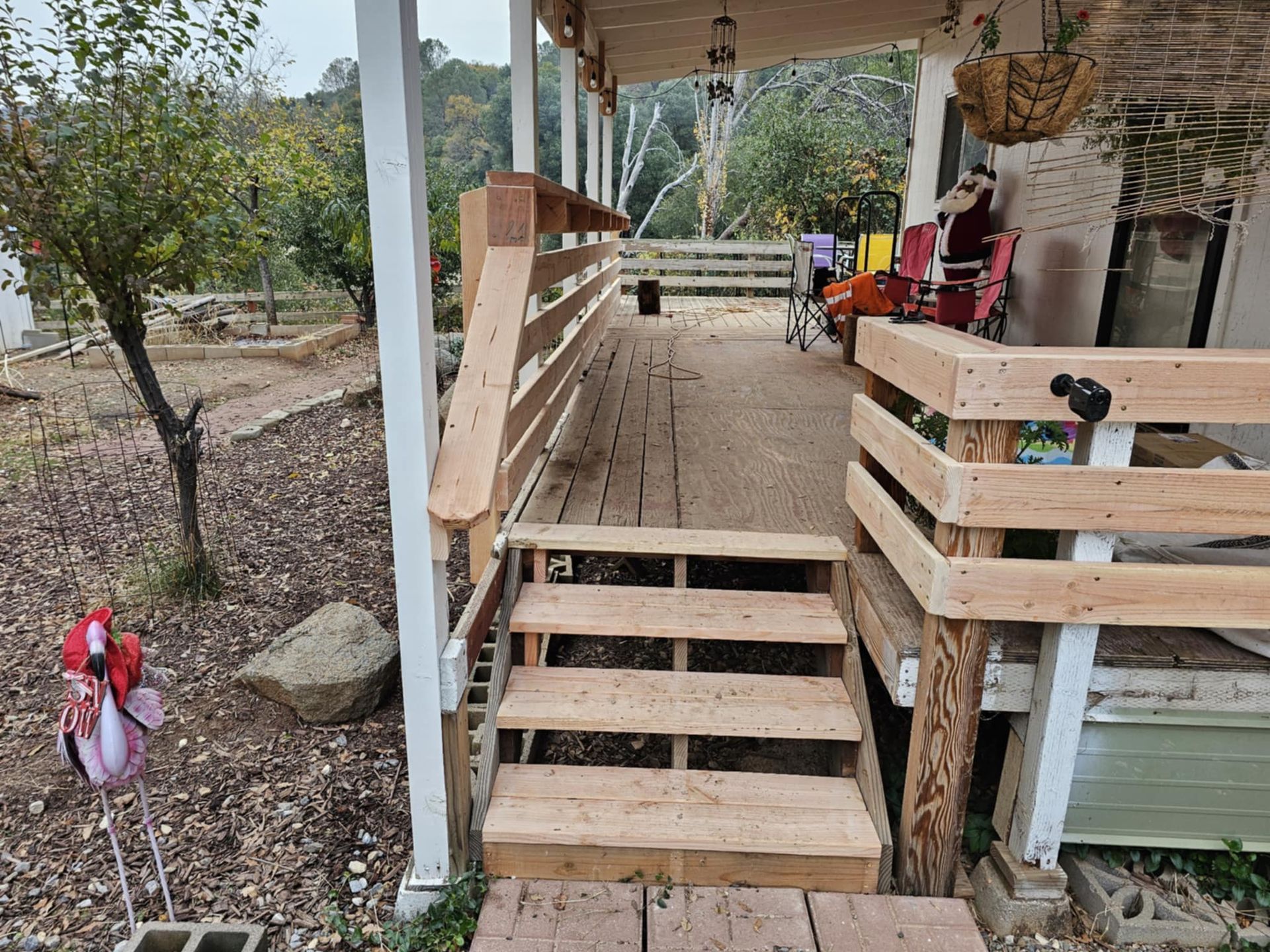 A wooden porch with stairs leading up to it.
