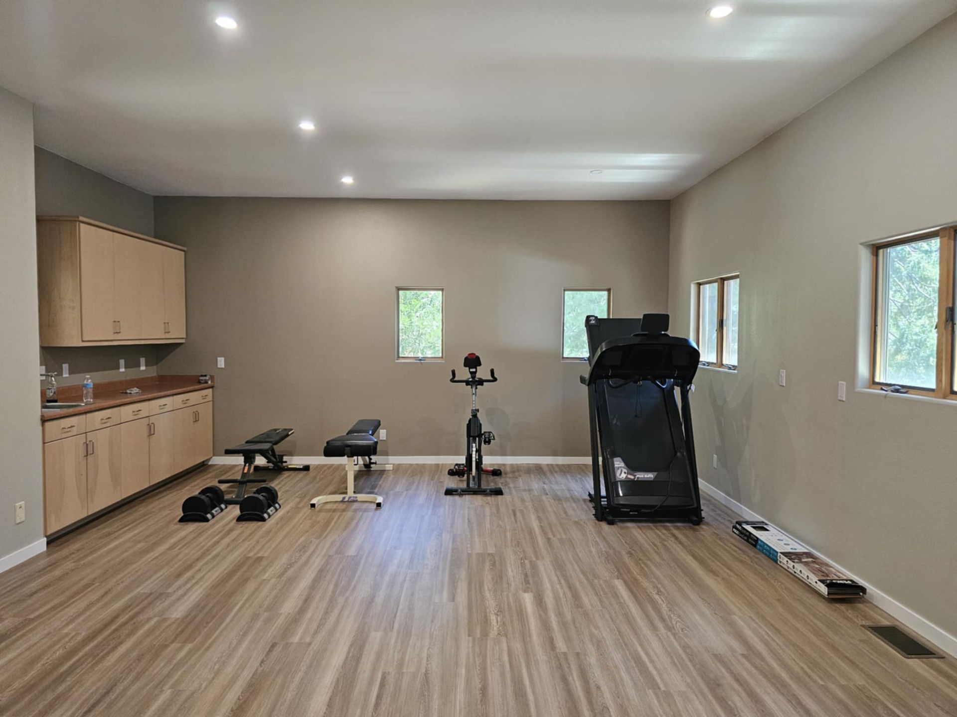 There is a treadmill in the middle of the room.