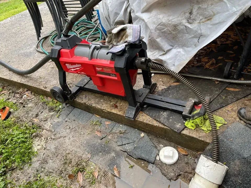 White plumbing pipes installed in a framed-out wall cavity; includes a box, wiring, and floor and wall tile.