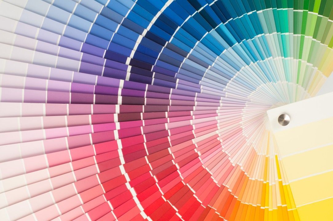 Color swatch fan with a spectrum of hues, from blue to red to yellow.