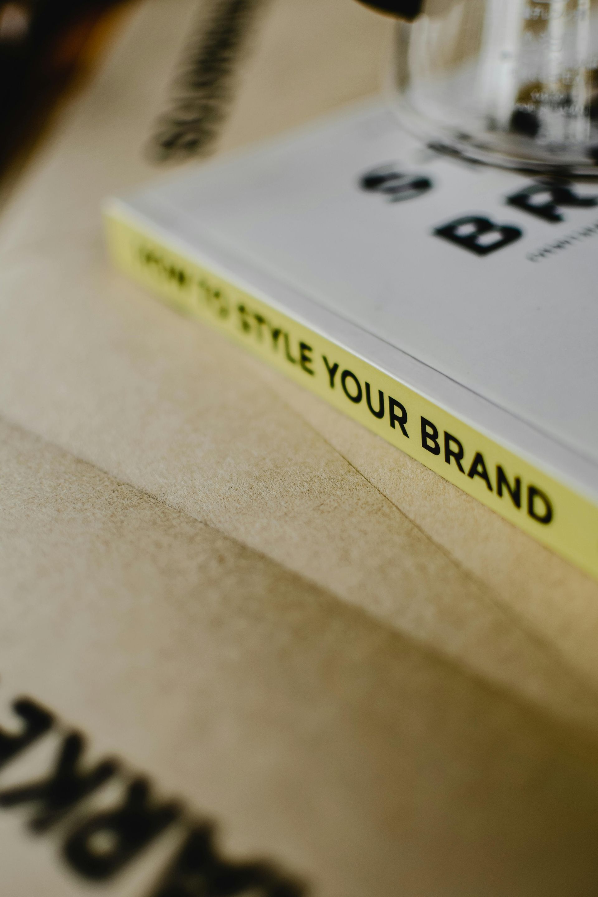 A close up of a book titled how to style your brand