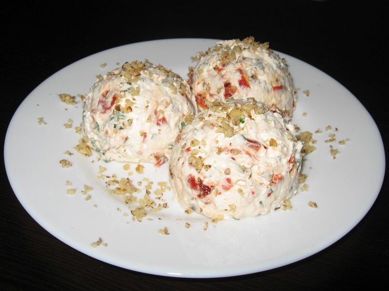 A bowl of tarator soup with a spoon in it is on a table