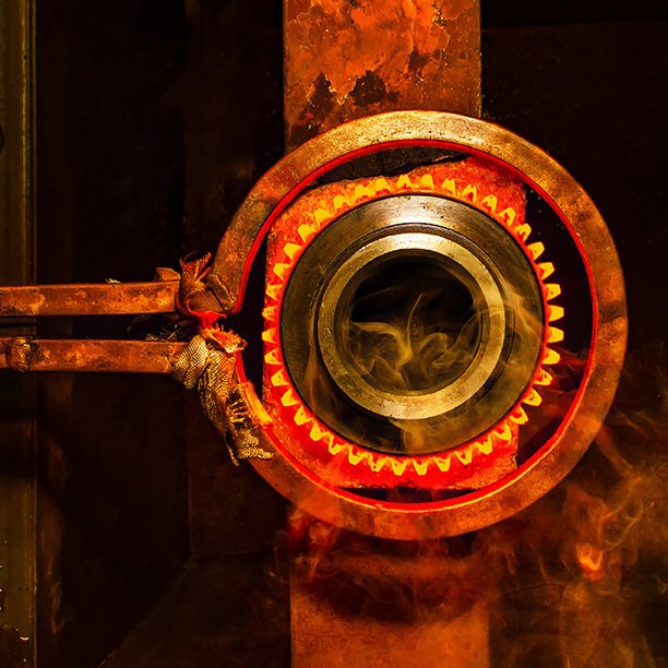 A close up of a metal object with smoke coming out of it.