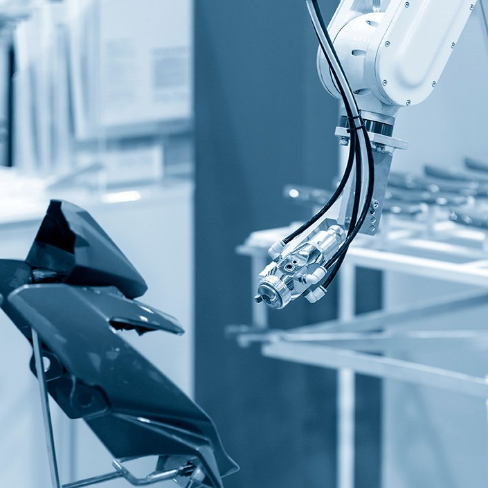 A robotic arm is working on a dental chair in a dental office.