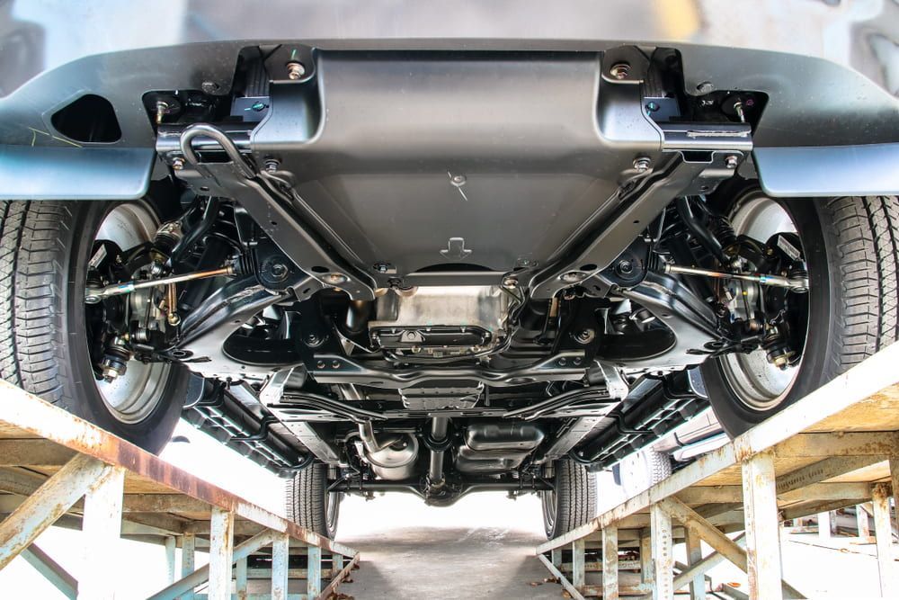 The Underside of a Car is Shown in a Garage — Secure Diesel & Automotive in Cloncurry, QLD