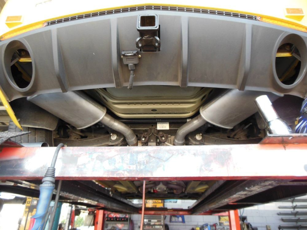 The Underside of a Car is Shown in a Garage — Bob Parkes Automotive in Hyde Park, QLD