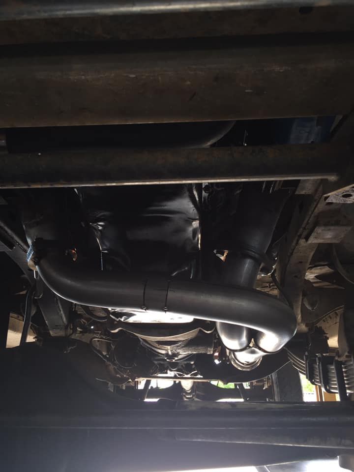 A Close Up of the Underside of a Car With Exhaust Pipes — Bob Parkes Automotive in Hyde Park, QLD