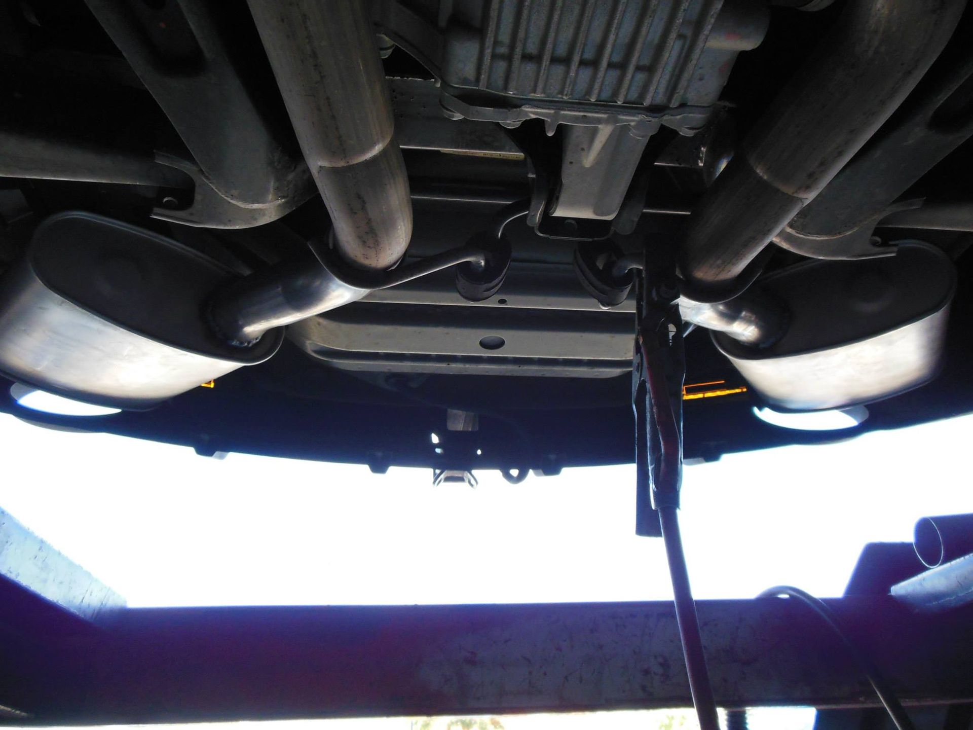 The Underside of a Car With the Exhaust Pipes Visible — Bob Parkes Automotive in Hyde Park, QLD