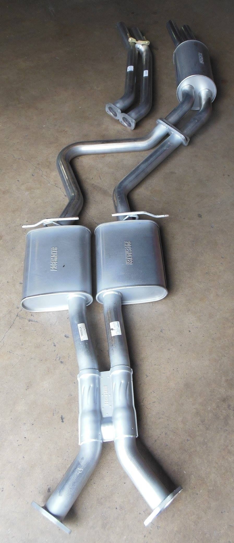 A Close Up of a Exhaust Pipe on a Concrete Surface — Bob Parkes Automotive in Hyde Park, QLD