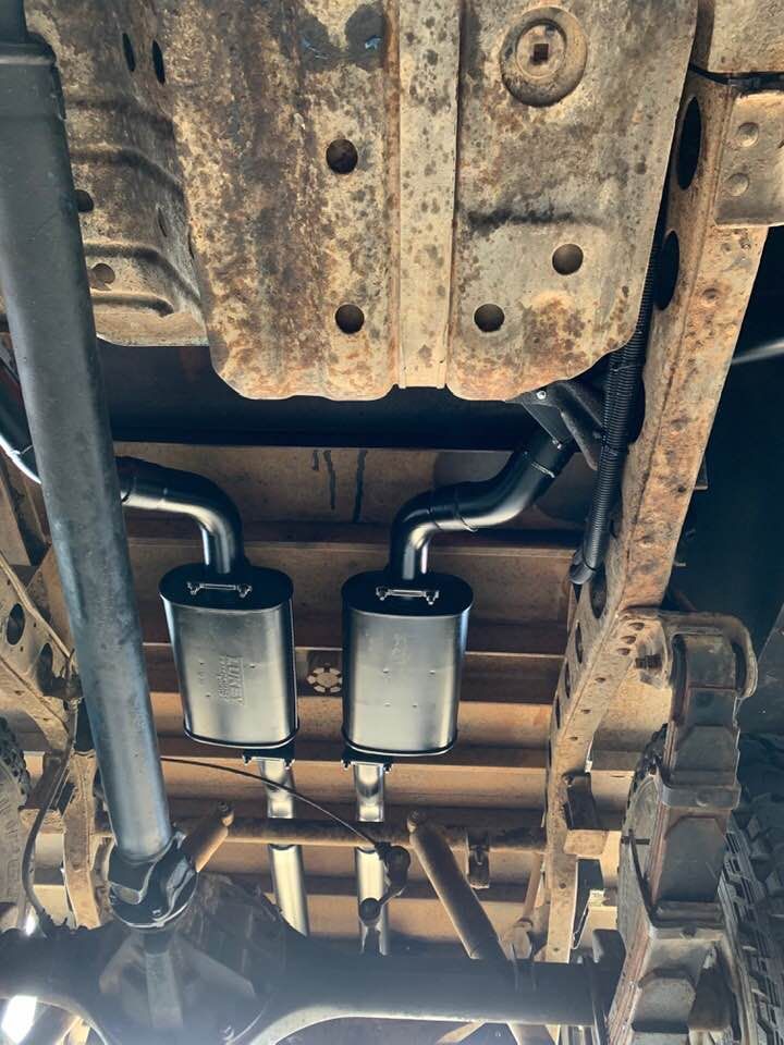 A Close Up of the Underside of a Truck With Exhaust Pipes — Bob Parkes Automotive in Hyde Park, QLD