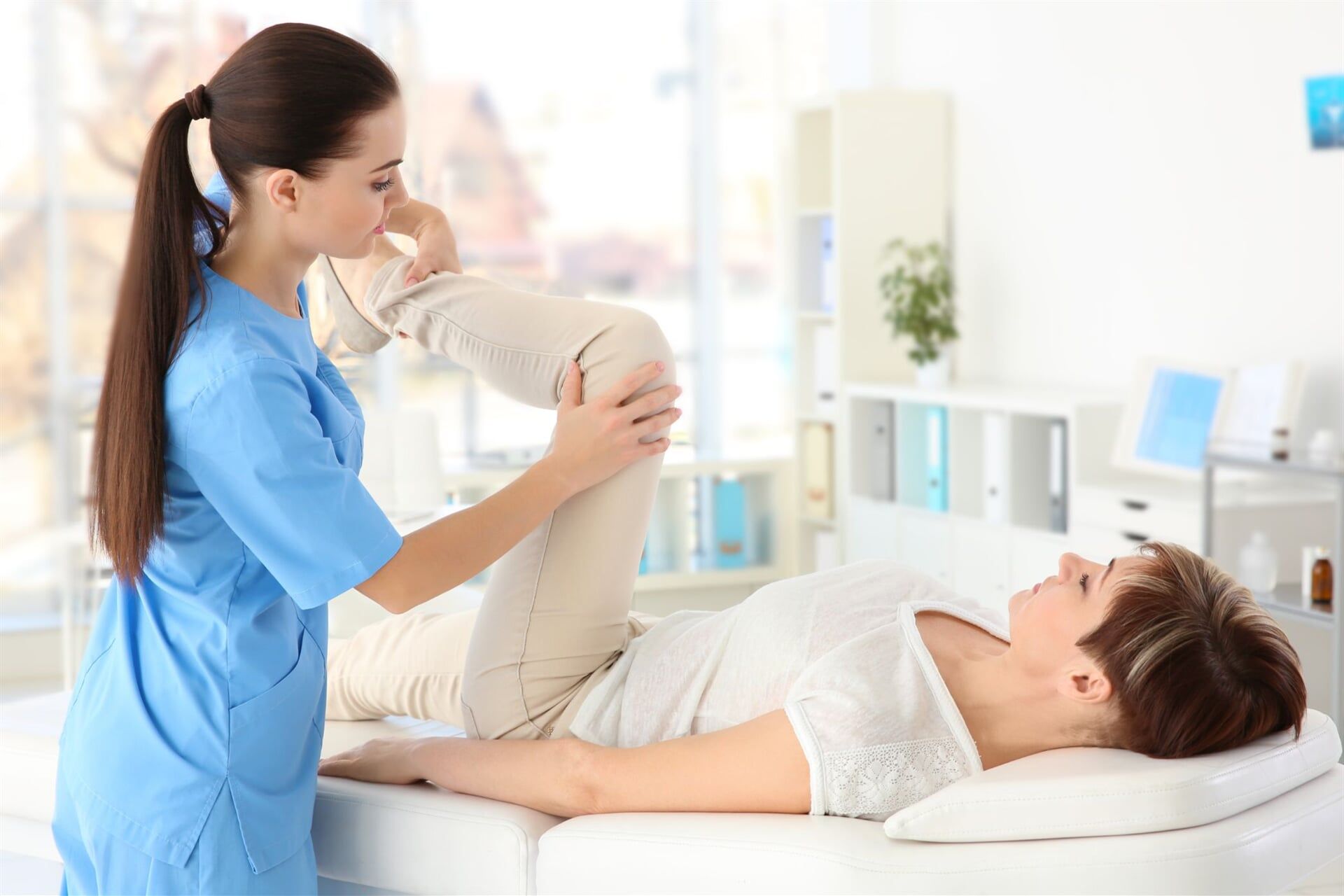 Therapist Helping a Woman with Her Joint Pain — Physiotherapists in Goulburn, NSW