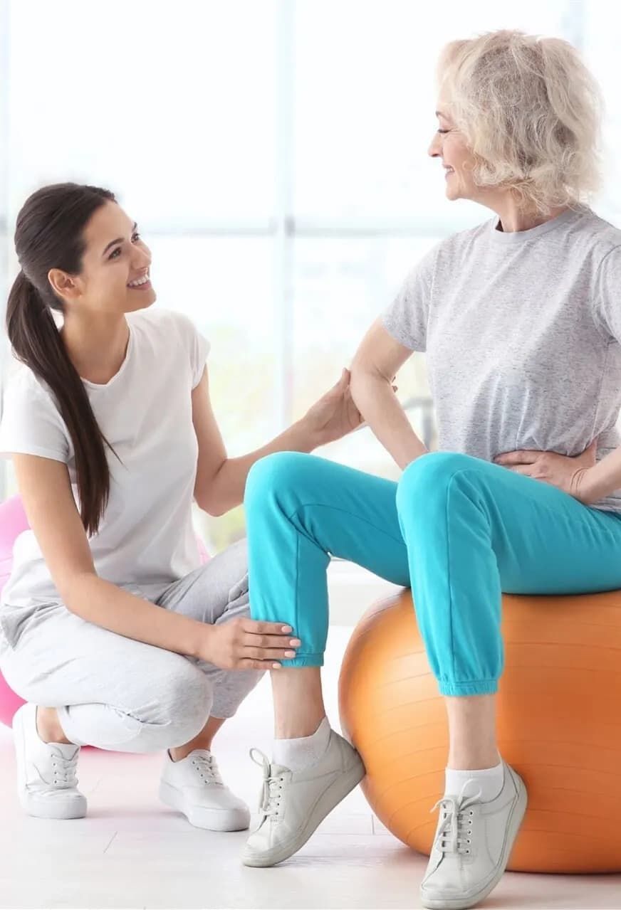 Therapist Helping a Woman to Recover with Her Injury  — Physiotherapists in Goulburn, NSW