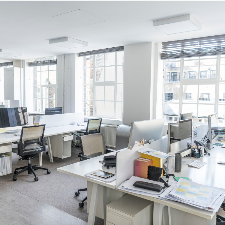 An office with a lot of desks and chairs