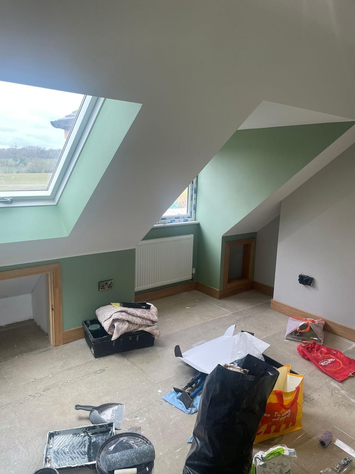 There is a window in the ceiling of the room.