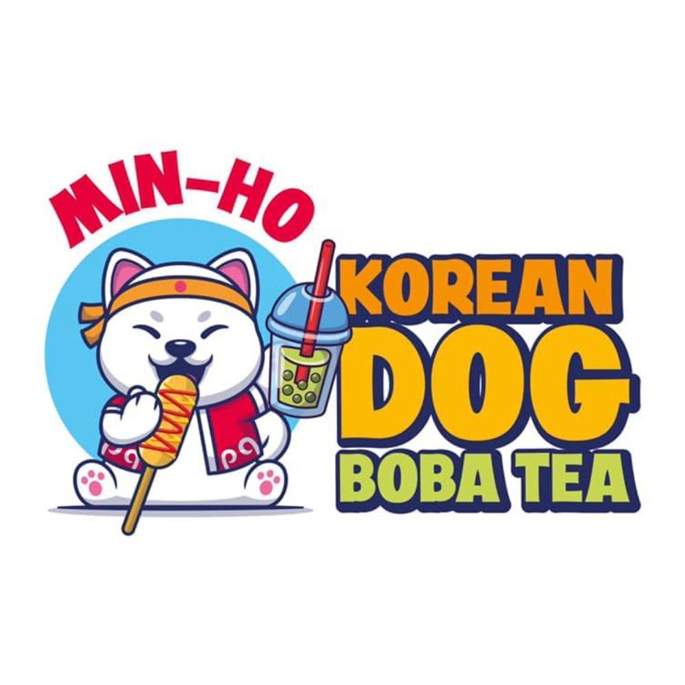 A korean dog is holding a cup of boba tea and a hot dog.