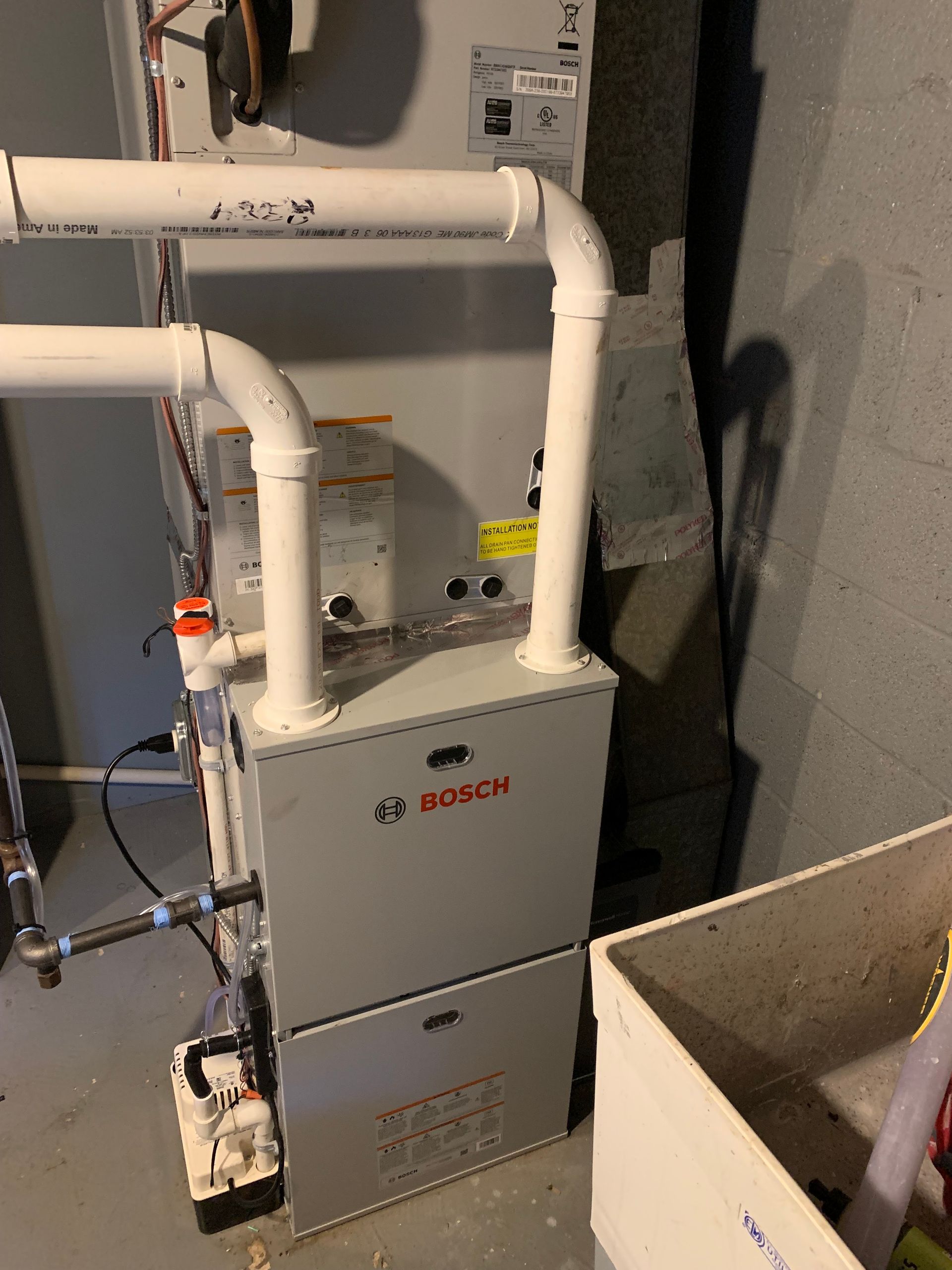 A wooden fence is sitting on top of a lush green field.
